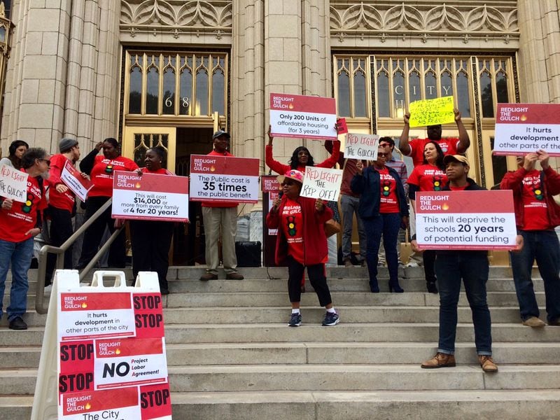 Members of Redlight the Gulch came to City Hall on Tuesday, Oct. 23, 2018, to protest the massive subsidy to develop the 40-acre chasm of train tracks and parking lots in downtown Atlanta. 
