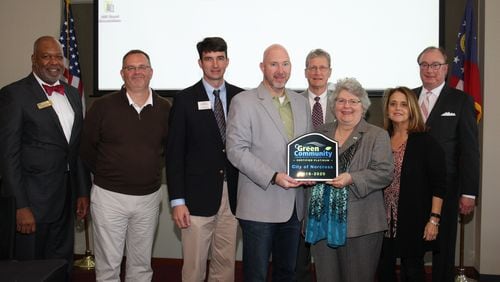 Norcross officials accept the Atlanta Regional Commission’s Platinum level Green Communities award for commitment to sustainability. Courtesy City of Norcross