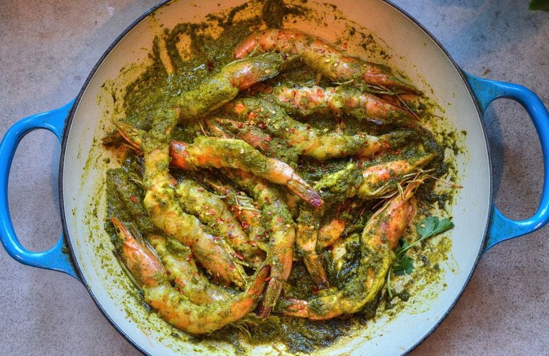 Chef Asha Gomez, who was born and raised in Kerala, India, prepared this Green Masala Shrimp. STYLING BY ASHA GOMEZ / CONTRIBUTED BY CHRIS HUNT