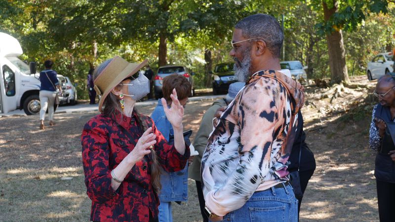 Edith Kelman of the First Existentialist Congregation and Deacon Gary Hargrove of Antioch East Baptist Church speak during the living history event at Candler Park. Photos: Eddy Anderson