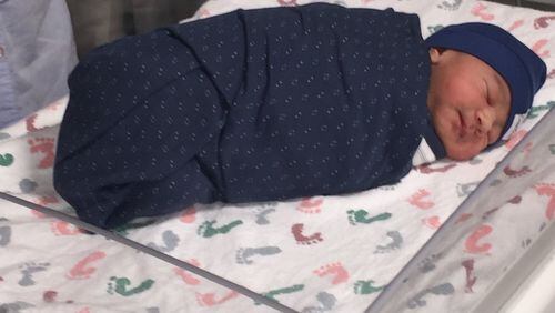 Baby Luca is bundled up after becoming the first baby born in metro Atlanta for the new year. (Photo provided by Emory Midtown Hospital)