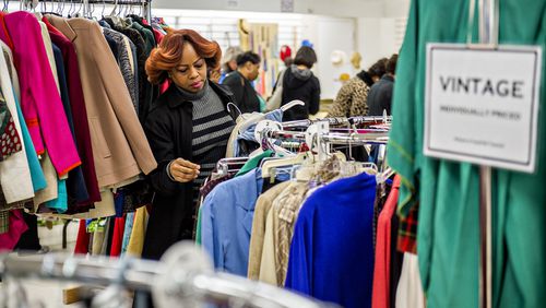 Sandy Springs - Ruth Hayes shops for vintage clothes during the  Sandy Springs Society Tossed Out Treasures sale at Marshall's Plaza in Sandy Springs in 2016. Proceeds from the sale support nonprofit organizations within the community.   JONATHAN PHILLIPS / SPECIAL