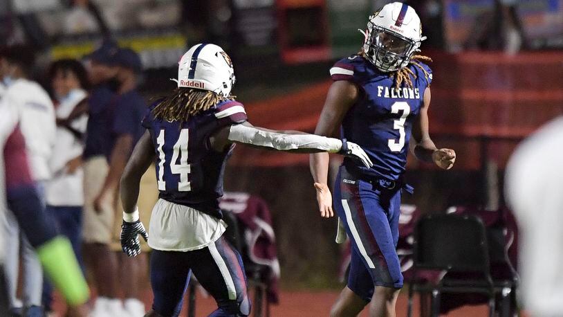 Pebblebrook wide receiver Christian Vega (14) celebrates with teammate Craig Adams Jr. after Adams scored a touchdown in the first half of  a game against North Atlanta at Pebblebrook.