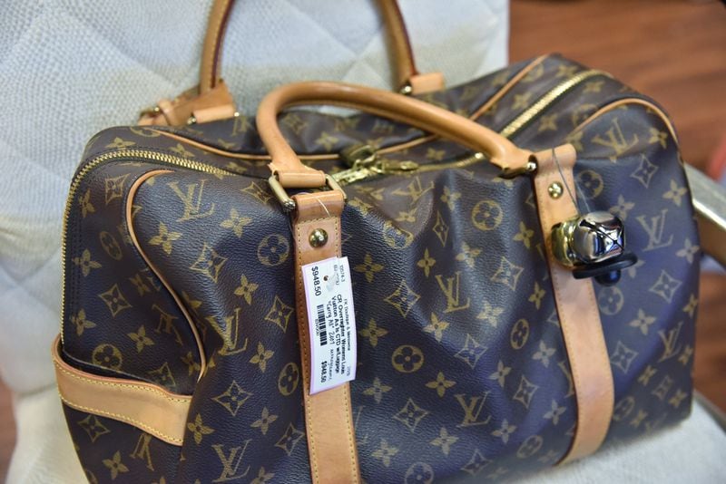 February 19, 2019 Decatur - Example of some of the high-end merchandise, Louis Vuitton bag, at Finders Keepers Consignment Stores in Decatur on Tuesday, February 19, 2019. Following the success of her best-selling 2014 book, Japanese organizing pro Marie Kondo has brought her KonMari method to the masses with a Netflix series and consultant training. The impact of her methods can be seen locally in massive drops to consignment stores and individuals adopting a KonMari approach to other areas of life. HYOSUB SHIN / HSHIN@AJC.COM