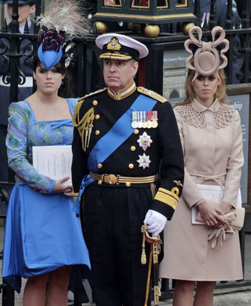 The hat that made the world gasp with horror. Prince Andrew (l-r) with his daughters Princess Eugenie and Princess Beatrice at the royal wedding of Will and Kate in 2011. Beatrice’s “fascinator,” which the British press uncharitably dubbed the “Squid Hat,” ended up being auctioned off for big charity bucks. 