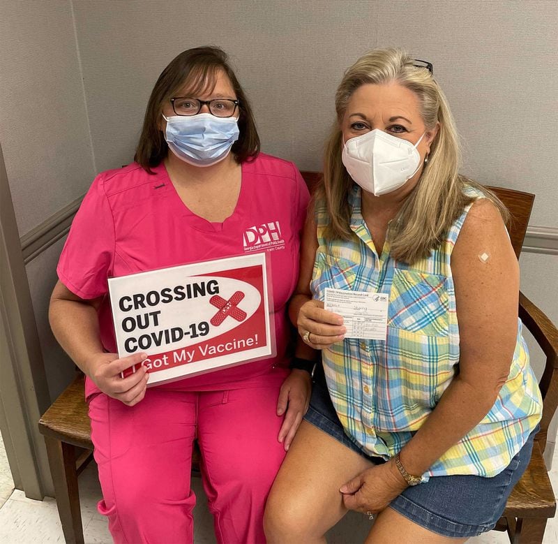 Sherry Clements Wilmot, right, poses with Jean Moore, from the Irwin County Health Department, on Friday, Aug. 27, 2021, after Clements received her second dose of the Moderna vaccine. (Courtesy of Sherry Clements Wilmot)