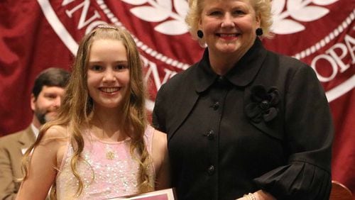 Anne Kallis of Holy Innocents’ Episcopal School (left) received the Alan A. Lewis Award from Principal Terri Potter (right) for exhibiting high standards of academic achievement, citizenship, and leadership.