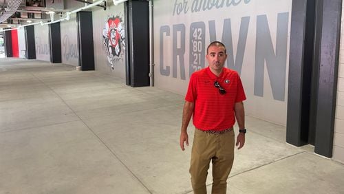 Associate AD for capital projects Tanner Stines speaks to reporters at the west entrance of the South 100 Concourse at Sanford Stadium on Thursday, Aug. 17, 2023. (Photo by Chip Towers/AJC)