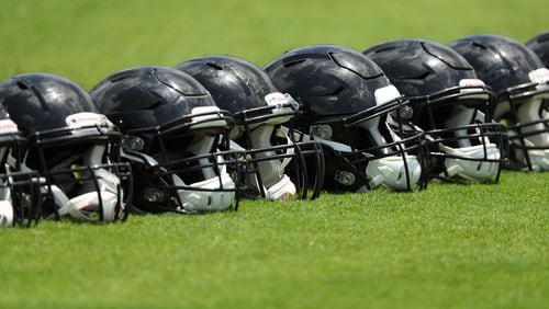 June 13, 2017, Flowery Branch: Falcons helmets line the field during the first day of mini-camp on Tuesday, June 13, 2017, in Flowery Branch. Curtis Compton/ccompton@ajc.com