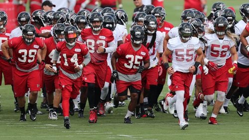 The Atlanta Falcons take to the field for the first day of training camp Thursday, July 28, 2016, in Flowery Branch.