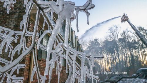 Ice forms where firefighters fought a blaze at Oak Tree Villas apartments in DeKalb County.