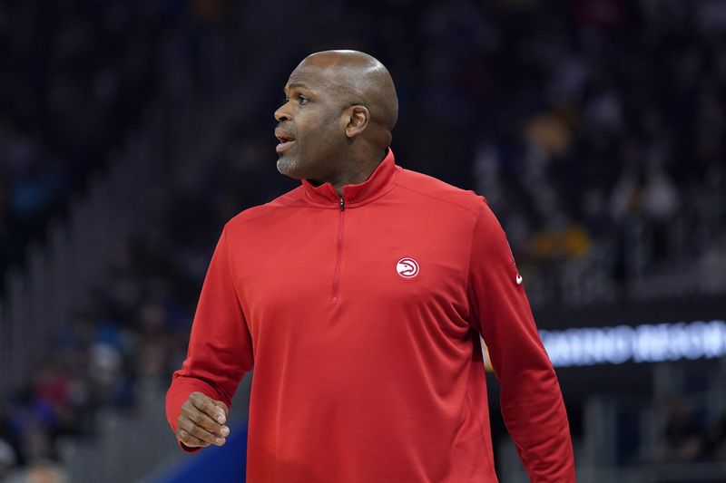 Atlanta Hawks head coach Nate McMillan watches from the sideline during the first half of his team's NBA basketball game against the Golden State Warriors in San Francisco, Monday, Nov. 8, 2021. (AP Photo/Jeff Chiu)