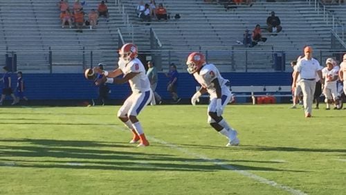 Parkview quarterback Fred Payton (9) hands off to running back Demetrius West (3) during warmups before their game against Peachtree Ridge. The Panthers beat the lions 50-13. (Photo Credit/ Alex Makrides)