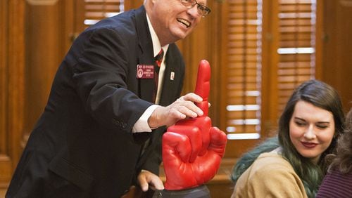 State Rep. Ed Rynders shows off the Georgia Bulldogs #1 finger before the beginning of the first day of the 2018 General Assembly in the Georgia House of Representatives in 2018. (Photo by Phil Skinner)