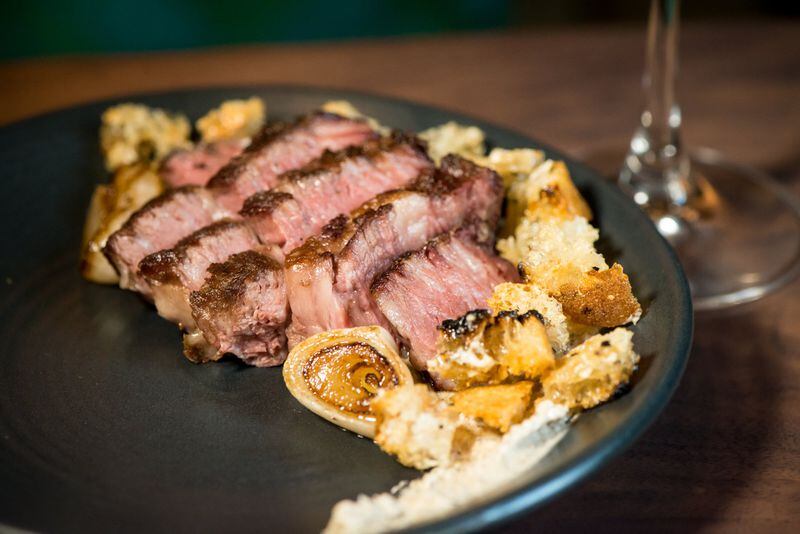  The 24-Hour Cast Iron Seared Steak with hand-cut, aged Wagyu, shiitake-maitre’d butter, grilled croutons and crispy onions. Photo credit: Mia Yakel.