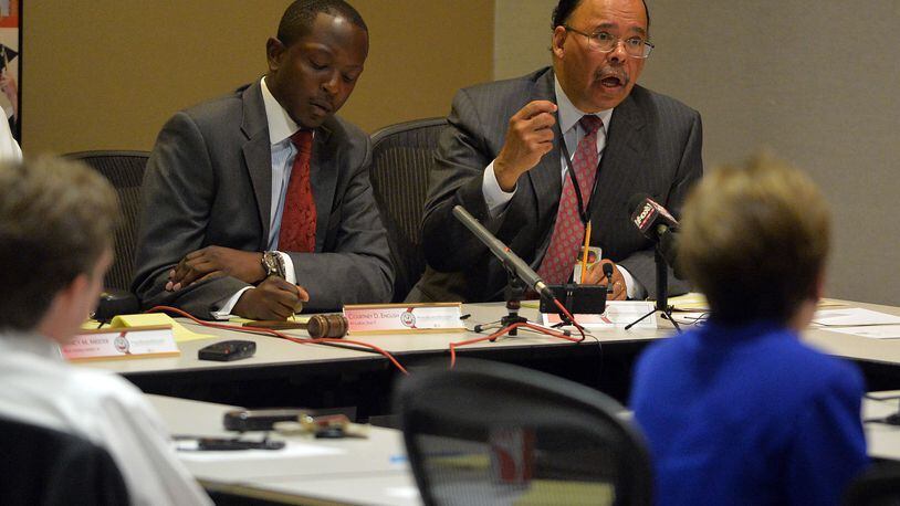 Former Atlanta School Superintendent Erroll Davis (right), makes a presentation as Atlanta School Board chairman Courtney English takes notes. Members of the Atlanta Board of Education and the Atlanta City Council met at APS headquarters Tuesday, July 8, 2014, to receive information related to the Intergovernmental Agreement between the City of Atlanta, Invest Atlanta and the Atlanta Independent School System regarding the Beltline project.