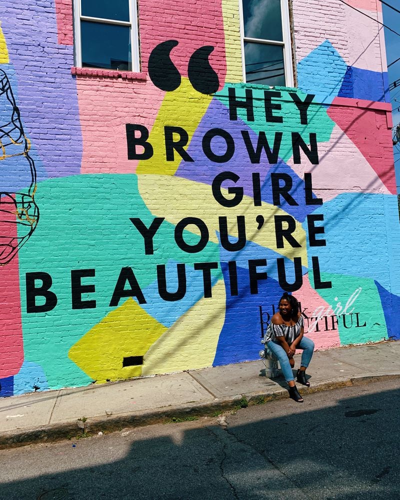 The “Hey Brown Girl” mural is located on the side of Peters Street Station. NAJJA PARKER / NAJJA.PARKER@AJC.COM