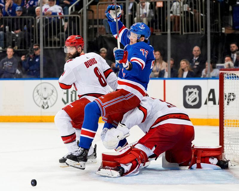 New York Rangers center Filip Chytil (72) collides with Carolina Hurricanes goaltender Frederik Andersen (31) during the second period in Game 2 of an NHL hockey Stanley Cup second-round playoff series Tuesday, May 7, 2024, in New York. At left is Hurricanes defenseman Brent Burns. (AP Photo/Julia Nikhinson)