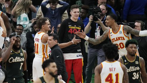 Atlanta Hawks guard Trae Young (11) is congratulated after the team's win over the Boston Celtics in Game 5 in a first-round NBA basketball playoff series Tuesday, April 25, 2023, in Boston. (AP Photo/Charles Krupa)