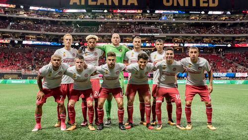 Atlanta United's starting 11 players pose before Wednesday's game against New England at Mercedes-Benz Stadium. (Eric Rossitch / Atlanta United)
