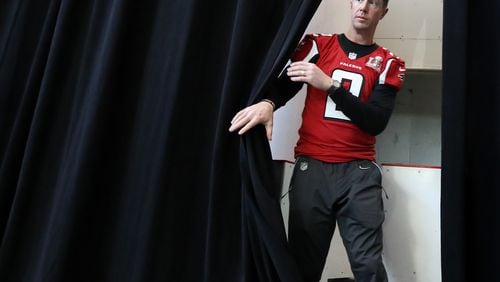 *** VISUAL LEDE *** February 1, 2017, Houston: The man behind the curtain, Falcons quarterback Matt Ryan makes his entrance for a press conference during Super Bowl media availability on Wednesday, Feb. 1, 2017, at the Memorial City Mall ice arena in Houston. Curtis Compton/ccompton@ajc.com