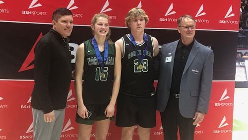 Alan Smith of event sponsor BSN (L) and GSGA executive director Robin Hines (R) with GSGA Coed 3-point contest winners Athena Vachtsevanos and Micah Jimerson of North Hall, March 7, 2024.