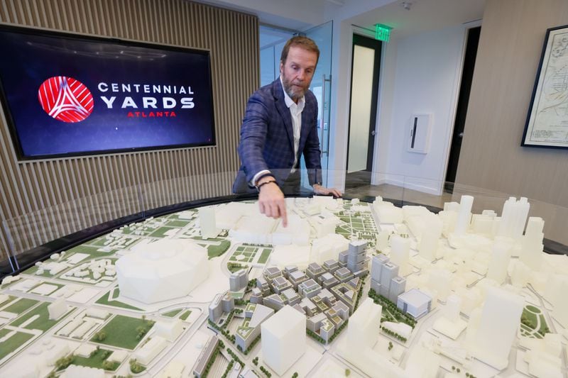 Brian McGowan, President of Centennial Yards, points to the 3D model of a significant development project underway in downtown Atlanta next to Mercedes-Benz Stadium. 
Miguel Martinez /miguel.martinezjimenez@ajc.com