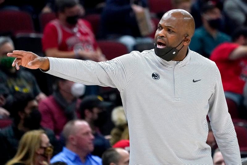 Atlanta Hawks head coach Nate McMillan calls his player during the first half of an NBA basketball game against the Chicago Bulls in Chicago, Wednesday, Dec. 29, 2021. (AP Photo/Nam Y. Huh)
