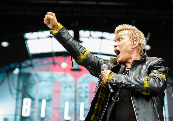 Atlanta, Ga: After a torrential downpour, Billy Idol came through and wowed the crowd with hits. The 68 year old didn't miss a beat despite wireless complications at the beginning of his set. Photo taken Sunday May 5, 2024 at Central Park, Old 4th Ward.  (RYAN FLEISHER FOR THE ATLANTA JOURNAL-CONSTITUTION)