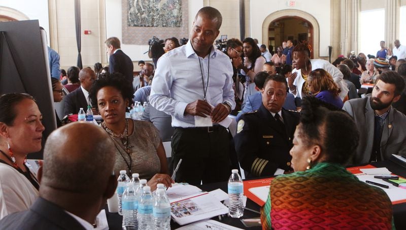 July 16, 2019 Atlanta- Kyle Rawlins, of Designing Justice Designing Spaces, stands up at his group table during a brainstorming session at the first meeting of the Reimagining Atlanta City Detention Center Task Force at City Hall in Atlanta on Tuesday, July 16, 2019. The purpose of the task force is to find another use for the Atlanta City Detention Center that would benefit the entire community. Christina Matacotta/Christina.Matacotta@ajc.com