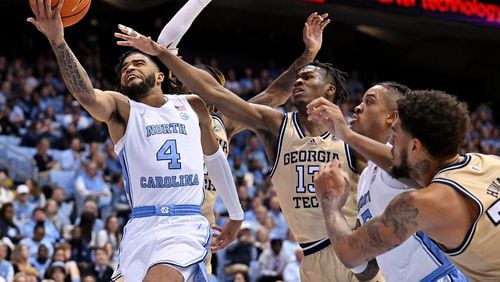 North Carolina's R.J. Davis (4) drives against Georgia Tech's Miles Kelly (13) during the second half at the Dean E. Smith Center on Saturday, Dec. 10, 2022, in Chapel Hill, North Carolina. (Grant Halverson/Getty Images/TNS)