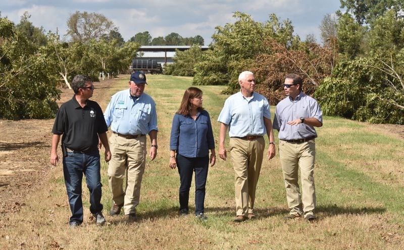 Vice President Mike Pence, the Second Lady of the United States Karen Pence and Secretary of Agriculture Sonny Perdue (left) talk with owners of Pecan Ridge Plantation Rob and Eric Cohen in Bainbridge, Ga. Pence surveyed storm damage from Hurricane Michael. HYOSUB SHIN / HSHIN@AJC.COM