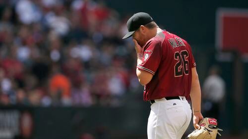 After walking in a run during the fourth inning, Arizona Diamondbacks pitcher Shelby Miller is pulled from a baseball game against the Colorado Rockies, Sunday, May 1, 2016, in Phoenix. (AP Photo/Ross D. Franklin)