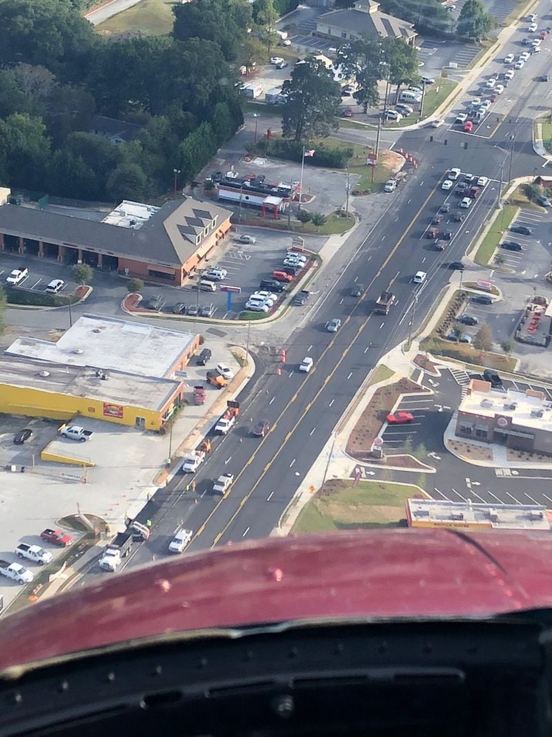 Crews paved Highway 20 north of Highway 316 during rush hour Tuesday, October 9th, causing big delays on both roads. Credit: Doug Turnbull, WSB Skycopter.