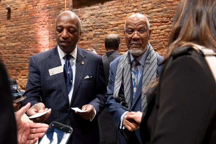 Rep. Billy Mitchell (D-Stone Mountain), left, and former Rep. Calvin Smyre greet people at the Wild Hog Supper, which is the traditional kick off to the legislative session in Atlanta on Sunday, Jan. 7, 2024.   (Ben Gray / Ben@BenGray.com)