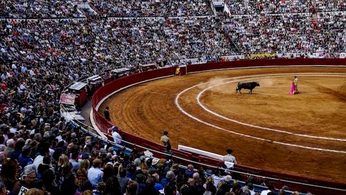Bullfighter Joselito Adame performs at Plaza Mexico, the biggest bullring in the world, in Mexico City, Jan 31, 2016. The day of bullfighting on Sunday featuring Jose Tomas and Joselito Adame, a Mexican matador, was the biggest of the winter season, if not the coming year, with front row seats being resold on websites for nearly $8,000 per ticket. (Adriana Zehbrauskas/The New York Times)
