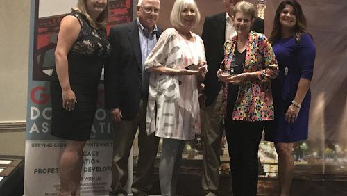 Janis and Paul Beavin, Robin and David Sullivan, and the North Gwinnett Arts Association representatives accept Downtown Excellence Awards at the 2018 Georgia Downtown Association Conference at Chateau Elan. Courtesy City of Suwanee