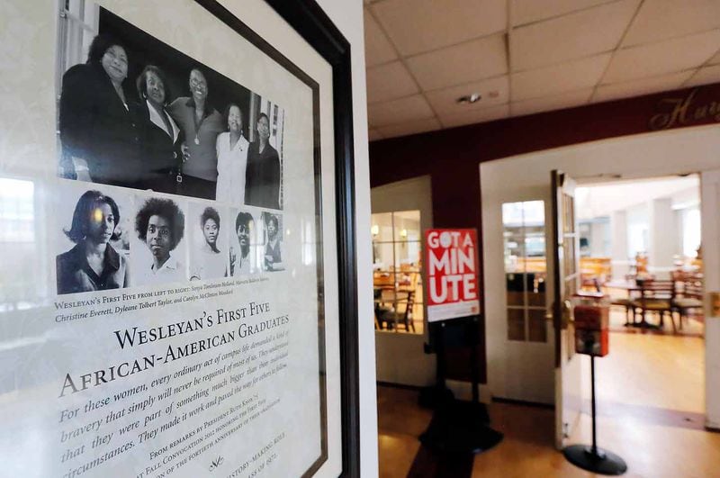 A framed poster near the dining hall commemorates the first five African-American Wesleyan graduates.