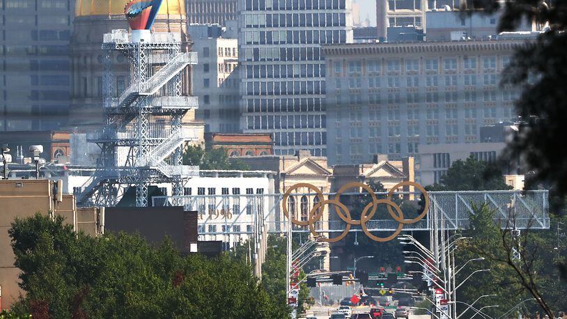 The Olympic cauldron and rings are seen against the Atlanta skyline on Monday, August 2, 2021, in Atlanta.  Curtis Compton / Curtis.Compton@ajc.com