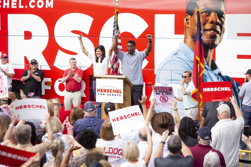 Former U.S. Ambassador to the UN Nikki Haley and U.S. Senate candidate Herschel Walker hold a Unite Georgia Bus Tour rally on Sunday, November 6, 2022, in Hiram.  Walker and Haley spoke at the rally for supporters ahead of the 2022 midterm election. (Christina Matacotta for The Atlanta Journal-Constitution)