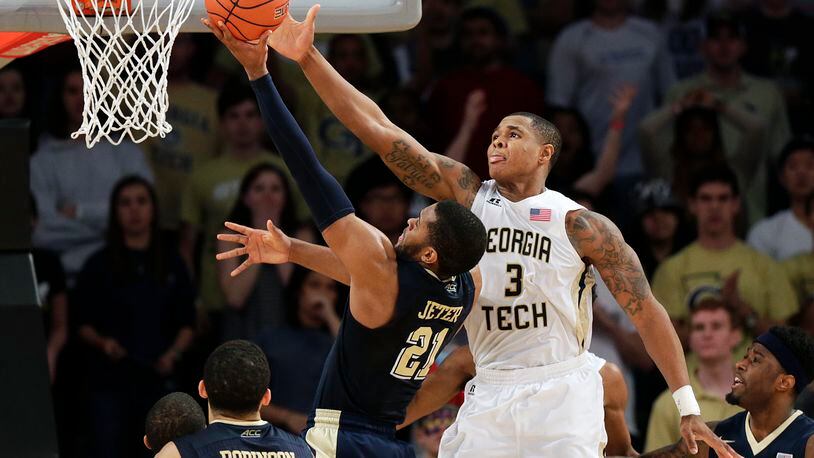 Georgia Tech's Marcus Georges-Hunt, right, defends against Pittsburgh's Sheldon Jeter in the second half of an NCAA college basketball game Saturday, March 5, 2016, in Atlanta. (AP Photo/David Goldman)