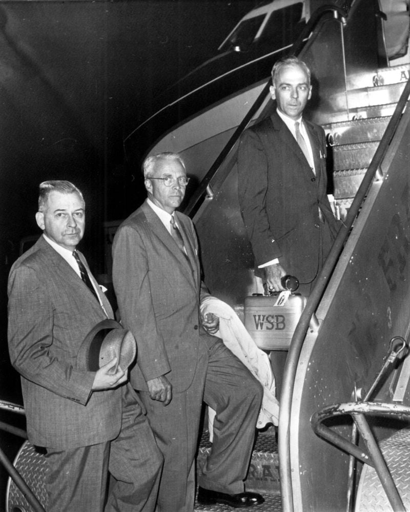 New York, June 4 - Mayor Ivan Allen, center, of Atlanta, Ga., boards a plane at New York's Idlewild Airport last night for flight to Paris and scene of Air France jetliner crash yesterday with killed 130, most of them Atlanta residents. With him are Edwin L. Sterne, left, assistant Atlanta city attorney, and Aubrey Morris, an Atlanta newscaster. 1962. AJC FILE PHOTO