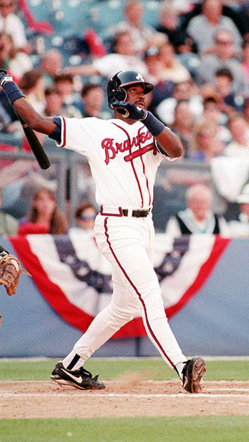 Fred McGriff watches a two-run homer sail over the fence at Atlanta-Fulton County Stadium.