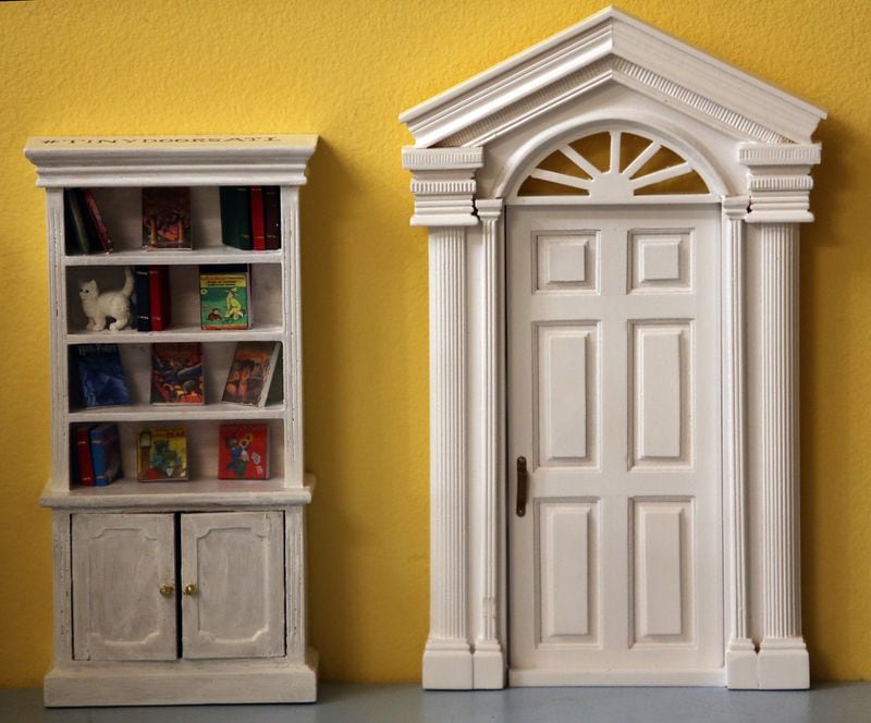 This tiny door and bookcase were installed at Little Shop of Stories in downtown Decatur in January 2015. A window at the beloved children’s bookstore will be the location of Tiny Doors ATL’s upcoming tiny library. AJC FILE PHOTO