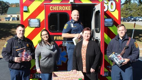 Helping to “Stuff a Squad” with gifts to benefit the Goshen Valley Boys Ranch are (from left) Cherokee County Sgt. Michael Sims, event coordinator Leslie Sullivan, Sgt. Nate Sullivan, Viktoriya Dubovis with Chart Industries, and Firefighter Trevor Newberry. CHEROKEE COUNTY FIRE & EMERGENCY SERVICES