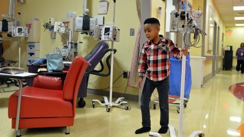 October 23, 2014 Atlanta: Antwon Thornton, 6, pushes his I.V pole while receiving a transfusion at Children's  Healthcare of Atlanta at Hughes Spalding Thursday October 23, 2014.  Thornton, who suffers from sickle cell disease, had his first stroke just before his second birthday. BRANT SANDERLIN / BSANDERLIN@AJC.COM