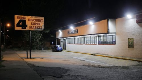 An Atlanta police officer fired shots at a fleeing vehicle in parking lot of this food mart in southwest Atlanta's Pittsburgh neighborhood early Thursday morning.