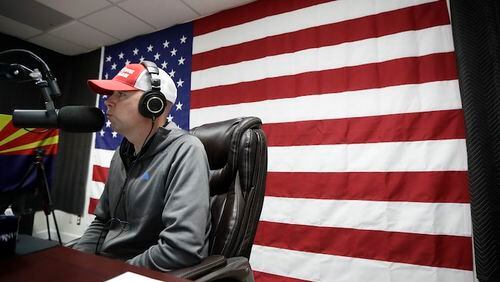 In this Feb. 21, 2017 image, Shawn Moran, a National Border Patrol Council vice president, speaks on air as part of "The Green Line," a weekly radio show by the U.S. Border Patrol agents' union that is sponsored by the conservative Breitbart News, in Solana Beach, Calif.  (AP Photo/Gregory Bull)
