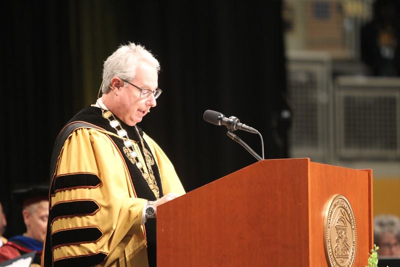 Kennesaw State University President Sam Olens addresses the crowd and graduating students at a commencement ceremony on May 10, 2017. 