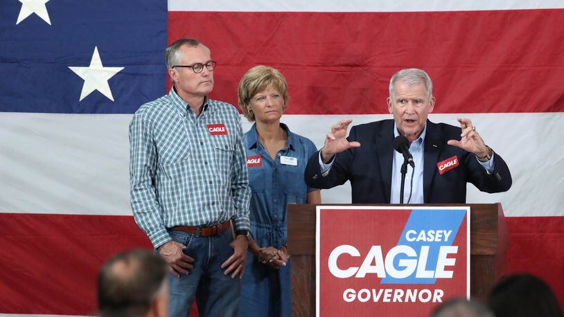 NRA President-elect Oliver North, right, speaks next to Lt. Gov. Casey Cagle and his wife Nita at the Governors Gun Club Saturday, July 14, 2018, in Kennesaw, Ga. (JASON GETZ/SPECIAL TO THE AJC)
